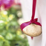 Ribbon-tied pebble tablecloth weight